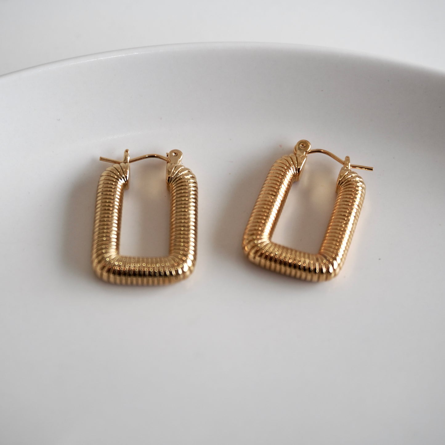 Aretes cuadrados líneas