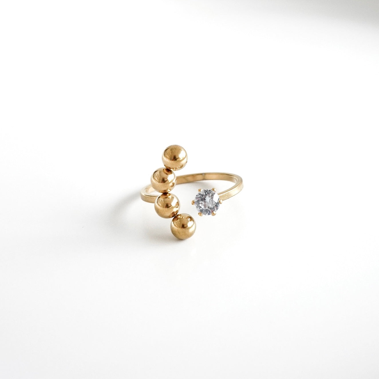 Anillo abierto bolitas y zirconia