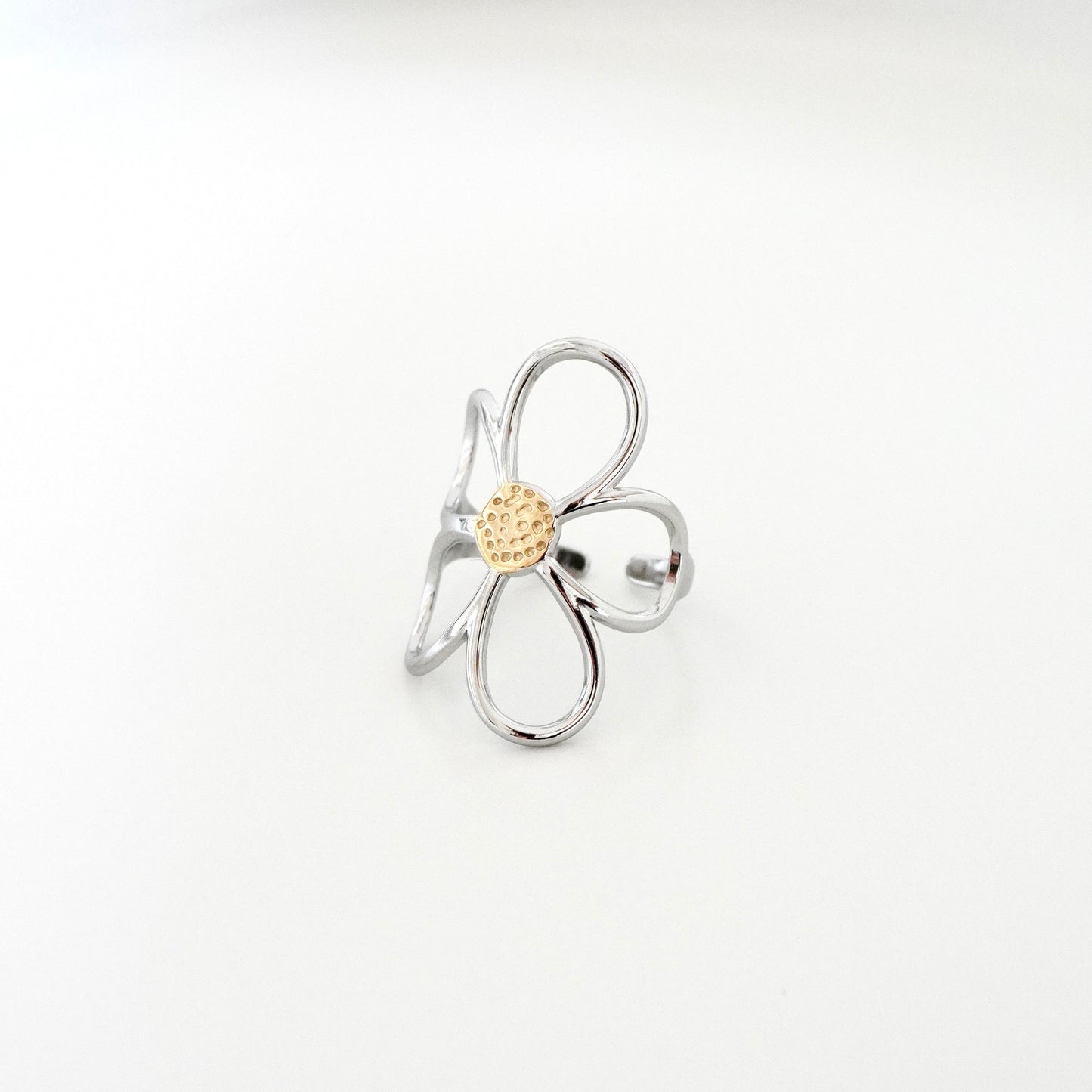Anillo silueta flor curva bicolor