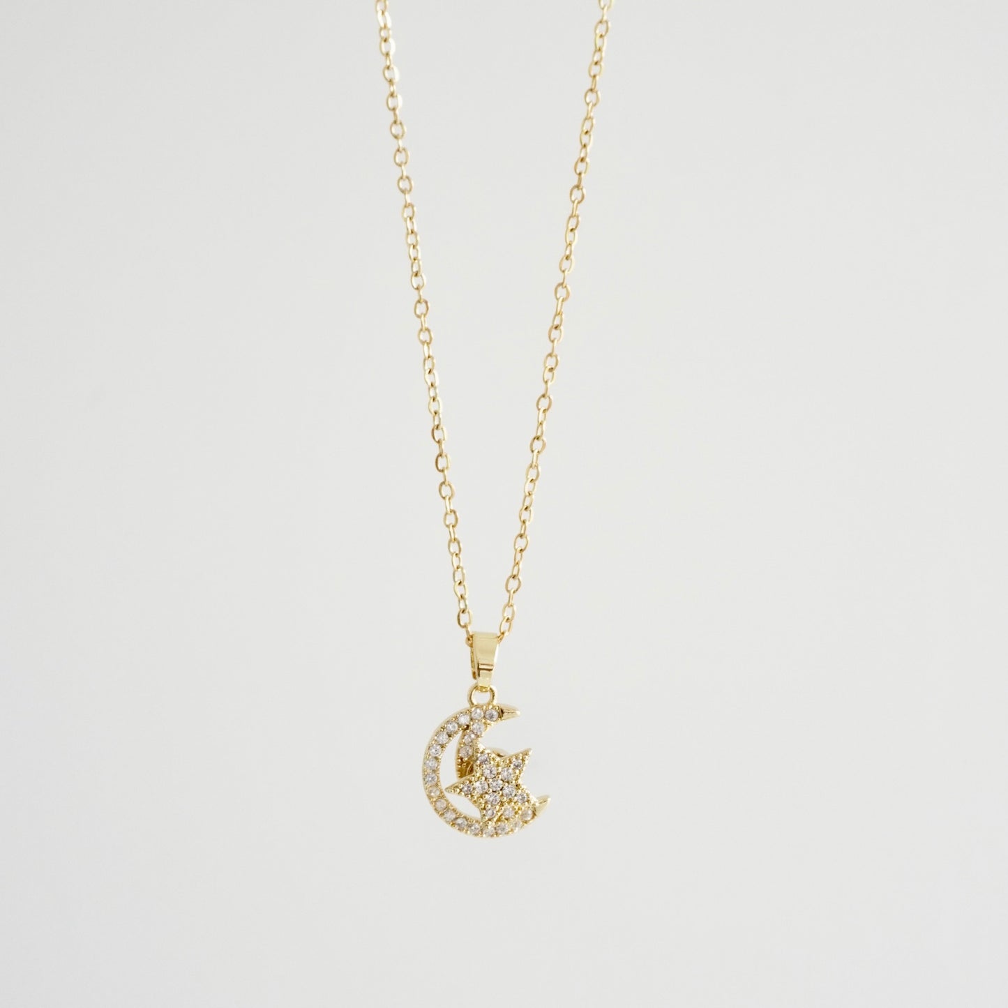 Cadena dije luna y estrella giratoria