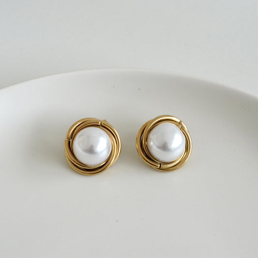 Aretes nido perla al centro