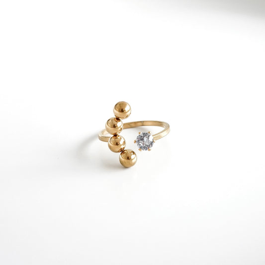 Anillo abierto bolitas y zirconia