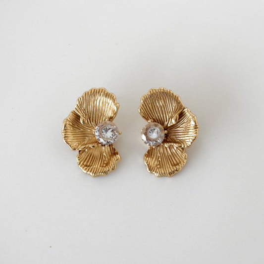 Aretes media flor